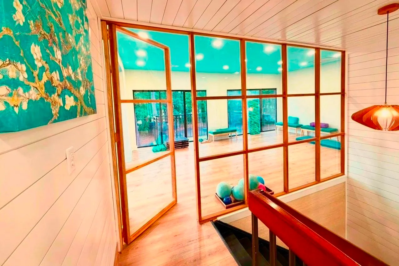 Inside the bright, airy Blue Sky Pilates studio on Hilton Head Island, with wood floors and lots of light